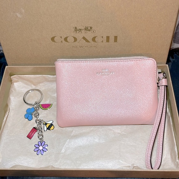 Like New Coach blush wristlet & box keychain not included - Picture 2 of 7